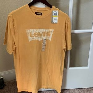 Brand new with tags, mustard yellow Levi Strauss Men’s round collar shirt.